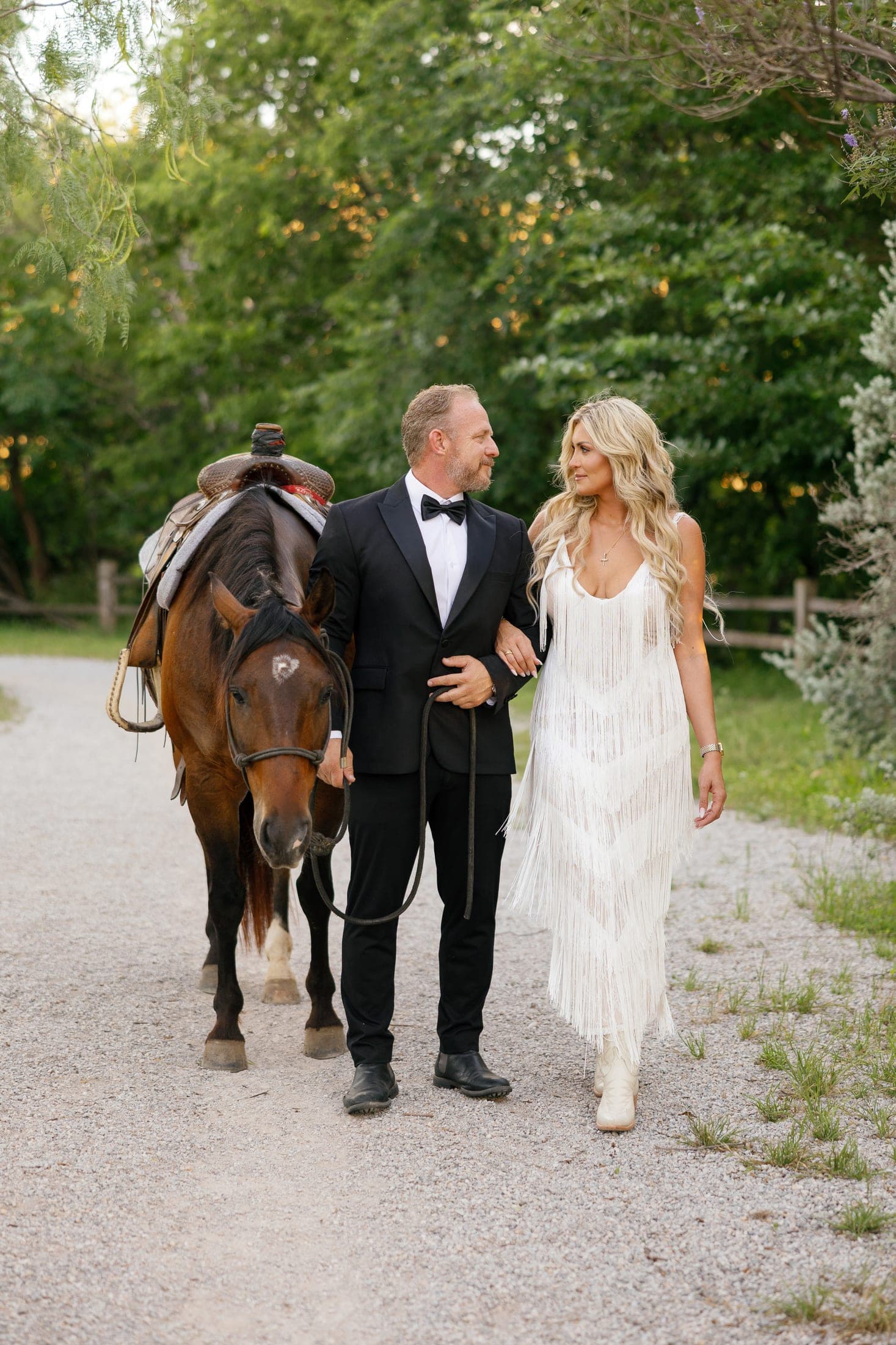 Nadia and Jason walking together with their horse